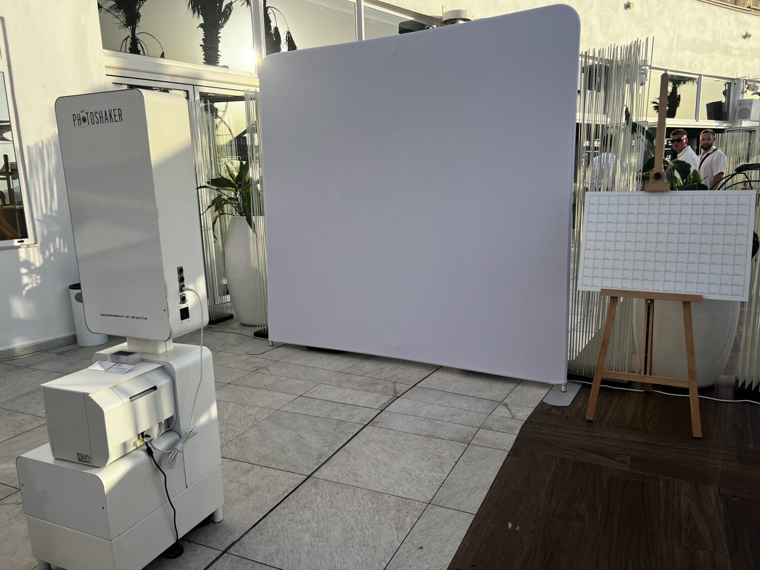 Backstage setup showing completed photo booth and blank mosaic grid for Zenith brand experience in Malta